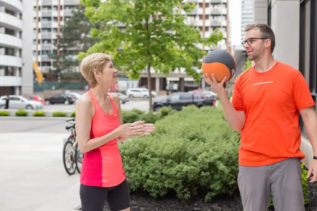 Exercising outdoors with Toronto Personal Trainer.