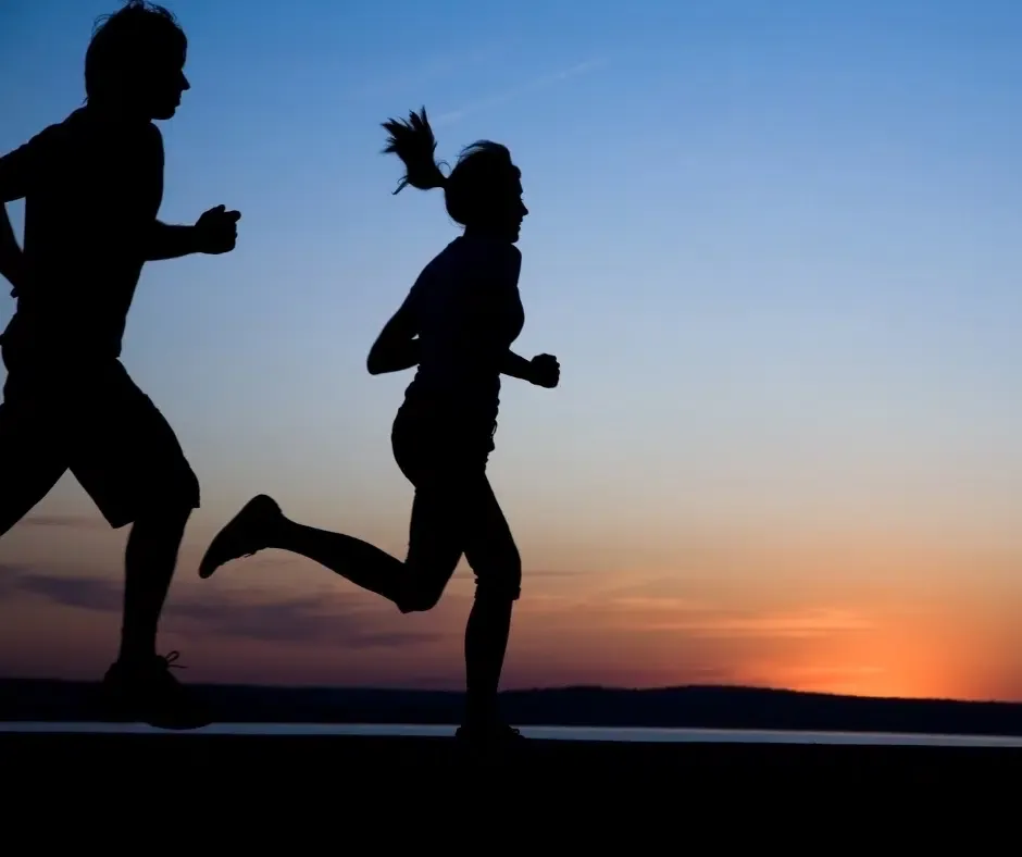 Running at night with a partner.